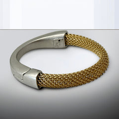 Signed Erica Zap bracelet featuring a woven 18K gold electroplated mesh band and a matte silver-tone crescent magnetic clasp. Artisan design with sculptural contrast between textures and tones. Shown from multiple angles to highlight clasp detail, mesh construction, and overall condition.