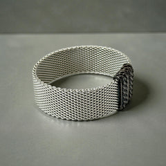 Erica Zap rhodium-plated mesh bracelet in black nickel finish with sculptural silhouette and magnetic clasp, likely new old stock.