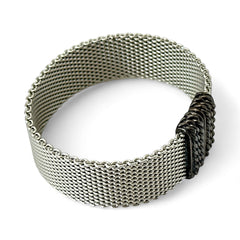 Erica Zap rhodium-plated mesh bracelet in black nickel finish with sculptural silhouette and magnetic clasp, likely new old stock.