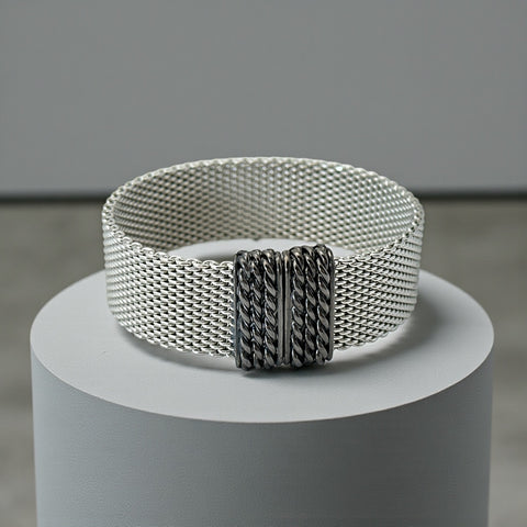 Erica Zap rhodium-plated mesh bracelet in black nickel finish with sculptural silhouette and magnetic clasp, likely new old stock.