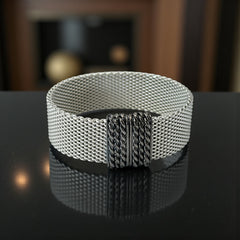 Erica Zap rhodium-plated mesh bracelet in black nickel finish with sculptural silhouette and magnetic clasp, likely new old stock.