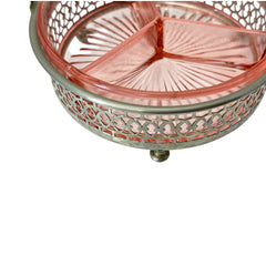 Vintage Farberware relish dish featuring pink Depression glass in a divided three-section design, set in a silver-tone openwork metal basket with arched handle and pedestal base; photographed in soft light to highlight its rosy hue and Art Deco detailing.