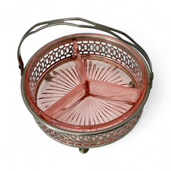 Vintage Farberware relish dish featuring pink Depression glass in a divided three-section design, set in a silver-tone openwork metal basket with arched handle and pedestal base; photographed in soft light to highlight its rosy hue and Art Deco detailing.