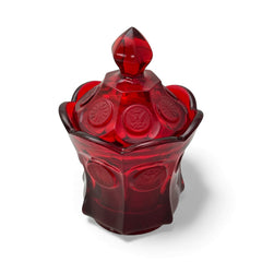 Vintage Fostoria Ruby Red Coin Glass candy dish with lid, featuring embossed coin medallions and a pointed finial; shown in rich red pressed glass with original Fostoria sticker, styled to highlight its collectible elegance and mid-century provenance.