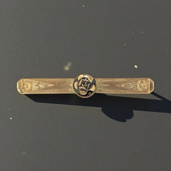Antique French Art Deco gold filled rose bar brooch, signed Oria, featuring a raised rose in a circular medallion with engraved floral motifs and a secure trombone clasp.