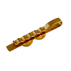 Vintage French gold‑tone tie clip with black enamel sunglasses motif from the 1980s.