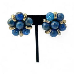 Vintage French clip-on earrings featuring marbled blue plastic beads with gold veining, arranged in a floral cluster with gold-tone rondelles, 1970s–1980s design, shown in very good condition.