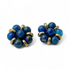 Vintage French clip-on earrings featuring marbled blue plastic beads with gold veining, arranged in a floral cluster with gold-tone rondelles, 1970s–1980s design, shown in very good condition.