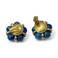 Vintage French clip-on earrings featuring marbled blue plastic beads with gold veining, arranged in a floral cluster with gold-tone rondelles, 1970s–1980s design, shown in very good condition.
