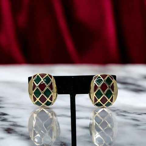 Pair of vintage French clip-on earrings with a rectangular gold-tone base, featuring a crisscross diamond lattice design filled with alternating deep red and forest green enamel; approx. 1" x ¾", late 1970s–1980s style, in very good condition with secure clips and rich color contrast.