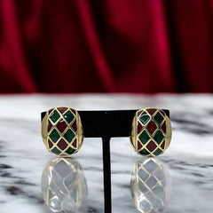 Pair of vintage French clip-on earrings with a rectangular gold-tone base, featuring a crisscross diamond lattice design filled with alternating deep red and forest green enamel; approx. 1" x ¾", late 1970s–1980s style, in very good condition with secure clips and rich color contrast.