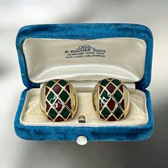 Pair of vintage French clip-on earrings with a rectangular gold-tone base, featuring a crisscross diamond lattice design filled with alternating deep red and forest green enamel; approx. 1" x ¾", late 1970s–1980s style, in very good condition with secure clips and rich color contrast.