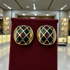Pair of vintage French clip-on earrings with a rectangular gold-tone base, featuring a crisscross diamond lattice design filled with alternating deep red and forest green enamel; approx. 1" x ¾", late 1970s–1980s style, in very good condition with secure clips and rich color contrast.