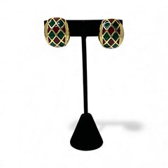Pair of vintage French clip-on earrings with a rectangular gold-tone base, featuring a crisscross diamond lattice design filled with alternating deep red and forest green enamel; approx. 1" x ¾", late 1970s–1980s style, in very good condition with secure clips and rich color contrast.