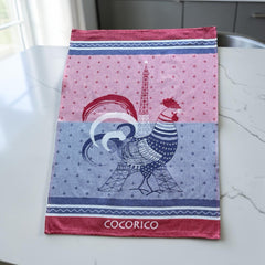 French jacquard cotton tea towel in blue, white, and red with rooster and Eiffel Tower motif and “Cocorico” lettering