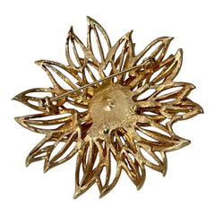 Vintage 1960s gold-tone floral brooch with openwork textured petals, featuring faux pearls and clear rhinestones on headpins at the center.