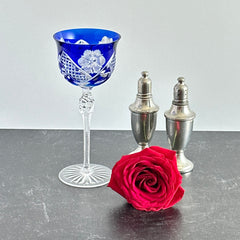 Vintage German cobalt blue cut crystal goblet with faceted stem, shown in excellent condition.