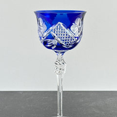 Vintage German cobalt blue cut crystal goblet with faceted stem, shown in excellent condition.