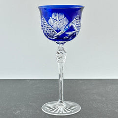 Vintage German cobalt blue cut crystal goblet with faceted stem, shown in excellent condition.