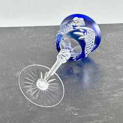 Vintage German cobalt blue cut crystal goblet with faceted stem, shown in excellent condition.
