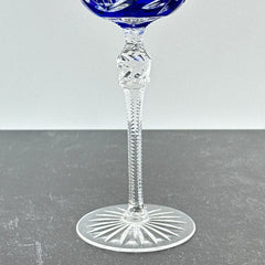 Vintage German cobalt blue cut crystal goblet with faceted stem, shown in excellent condition.