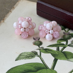Vintage Germany light pink bead cluster clip‑on earrings with pearlized, crackled, and translucent beads in gold‑tone settings, signed Germany on the back.