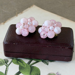 Vintage Germany light pink bead cluster clip‑on earrings with pearlized, crackled, and translucent beads in gold‑tone settings, signed Germany on the back.
