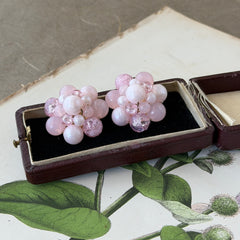 Vintage Germany light pink bead cluster clip‑on earrings with pearlized, crackled, and translucent beads in gold‑tone settings, signed Germany on the back.
