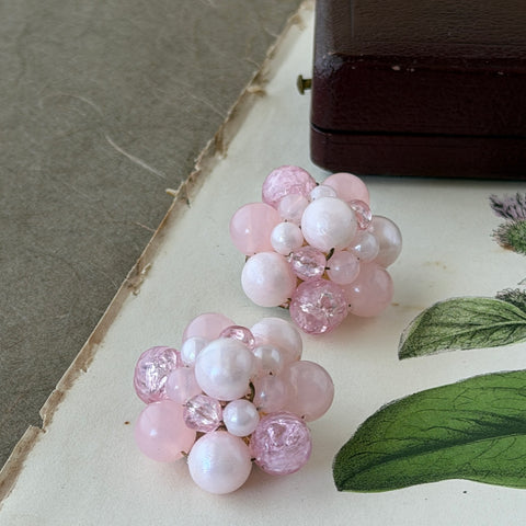 Vintage Germany light pink bead cluster clip‑on earrings with pearlized, crackled, and translucent beads in gold‑tone settings, signed Germany on the back.