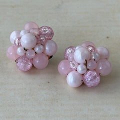 Vintage Germany light pink bead cluster clip‑on earrings with pearlized, crackled, and translucent beads in gold‑tone settings, signed Germany on the back.