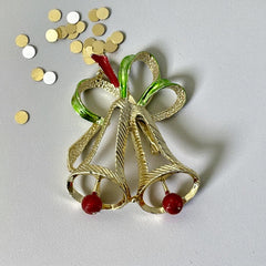 Vintage Gerry’s Christmas bells brooch in gold tone metal with red and green enamel ribbon, signed on back, festive mid-century holiday jewelry.