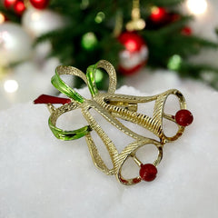 Vintage Gerry’s Christmas bells brooch in gold tone metal with red and green enamel ribbon, signed on back, festive mid-century holiday jewelry.