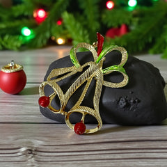 Vintage Gerry’s Christmas bells brooch in gold tone metal with red and green enamel ribbon, signed on back, festive mid-century holiday jewelry.