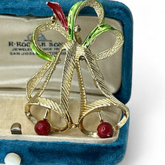 Vintage Gerry’s Christmas bells brooch in gold tone metal with red and green enamel ribbon, signed on back, festive mid-century holiday jewelry.