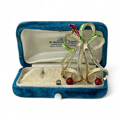 Vintage Gerry’s Christmas bells brooch in gold tone metal with red and green enamel ribbon, signed on back, festive mid-century holiday jewelry.