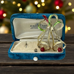 Vintage Gerry’s Christmas bells brooch in gold tone metal with red and green enamel ribbon, signed on back, festive mid-century holiday jewelry.