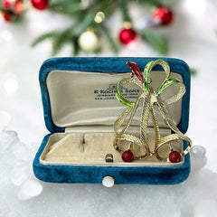 Vintage Gerry’s Christmas bells brooch in gold tone metal with red and green enamel ribbon, signed on back, festive mid-century holiday jewelry.
