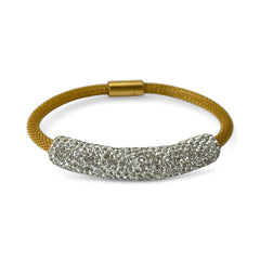 Gold tone mesh bracelet with a curved white centerpiece set with clear rhinestones over silver foil backing, creating a bright silvery shimmer; finished with a magnetic clasp and sleek modern design.