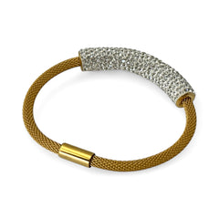 Gold tone mesh bracelet with a curved white centerpiece set with clear rhinestones over silver foil backing, creating a bright silvery shimmer; finished with a magnetic clasp and sleek modern design.