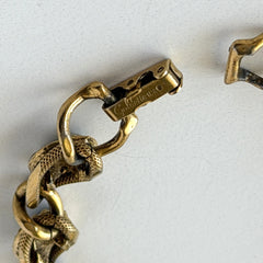 Vintage Goldette N.Y. bracelet with alternating green cabochons and faux pearls in textured gold‑tone curb links, fold‑over clasp signed Goldette N.Y.