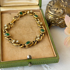 Vintage Goldette N.Y. bracelet with alternating green cabochons and faux pearls in textured gold‑tone curb links, fold‑over clasp signed Goldette N.Y.