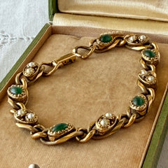 Vintage Goldette N.Y. bracelet with alternating green cabochons and faux pearls in textured gold‑tone curb links, fold‑over clasp signed Goldette N.Y.