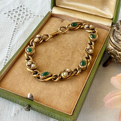 Vintage Goldette N.Y. bracelet with alternating green cabochons and faux pearls in textured gold‑tone curb links, fold‑over clasp signed Goldette N.Y.