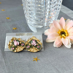 Vintage 1980s teardrop post earrings with 3D pink polymer clay rose, green enamel base, and gold tone pressed metal scrollwork on original card.