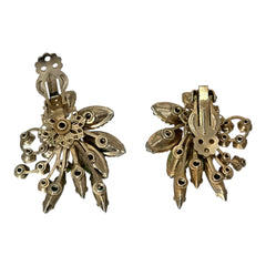 Vintage 1960s clip-on floral earrings with green and iridescent rhinestones in chaton, navette, and marquise cuts, set in gold-tone metal—sparkling midcentury costume jewelry in very good condition.