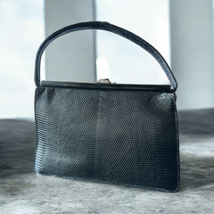 Vintage black Harry Rosenfeld handbag made of mixed exotic skins with a textured body, curved exotic-skin handle, and pavé rhinestone fruit clasp, shown from various angles including the satin-lined interior with signature label.