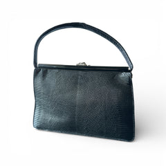 Vintage black Harry Rosenfeld handbag made of mixed exotic skins with a textured body, curved exotic-skin handle, and pavé rhinestone fruit clasp, shown from various angles including the satin-lined interior with signature label.