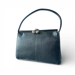 Vintage black Harry Rosenfeld handbag made of mixed exotic skins with a textured body, curved exotic-skin handle, and pavé rhinestone fruit clasp, shown from various angles including the satin-lined interior with signature label.