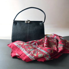 Vintage black Harry Rosenfeld handbag made of mixed exotic skins with a textured body, curved exotic-skin handle, and pavé rhinestone fruit clasp, shown from various angles including the satin-lined interior with signature label.