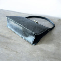 Vintage black Harry Rosenfeld handbag made of mixed exotic skins with a textured body, curved exotic-skin handle, and pavé rhinestone fruit clasp, shown from various angles including the satin-lined interior with signature label.